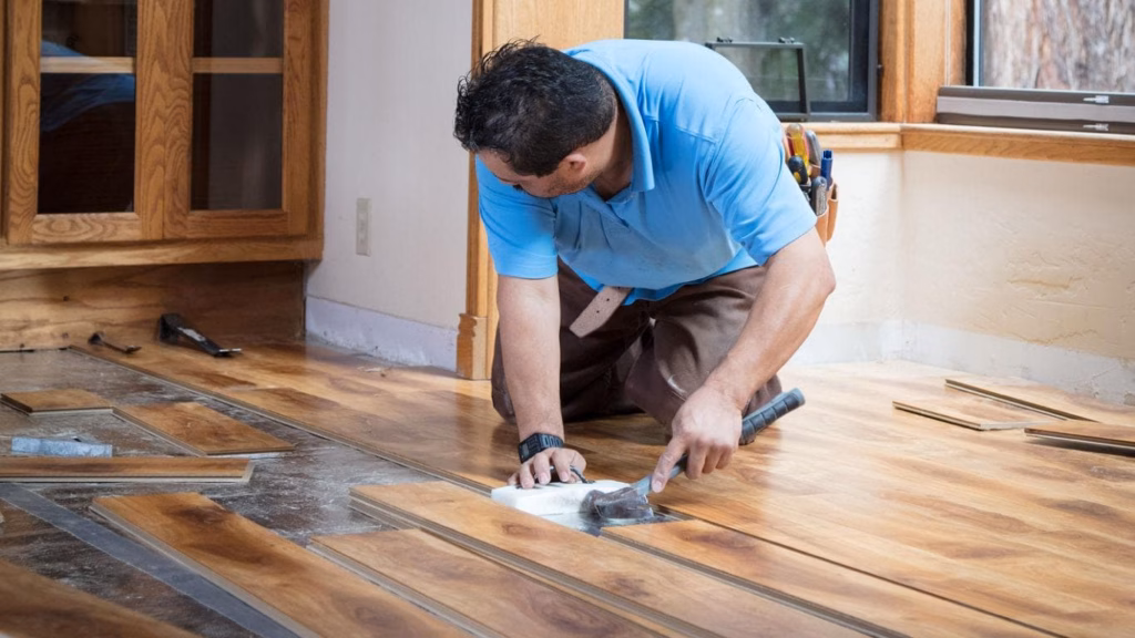 Professional hardwood flooring installation showing evenly aligned wood planks and a smooth, finished residential floor