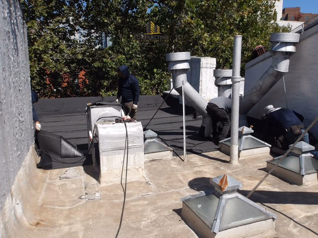 flat roof restoration east village manhattan with Johns manville